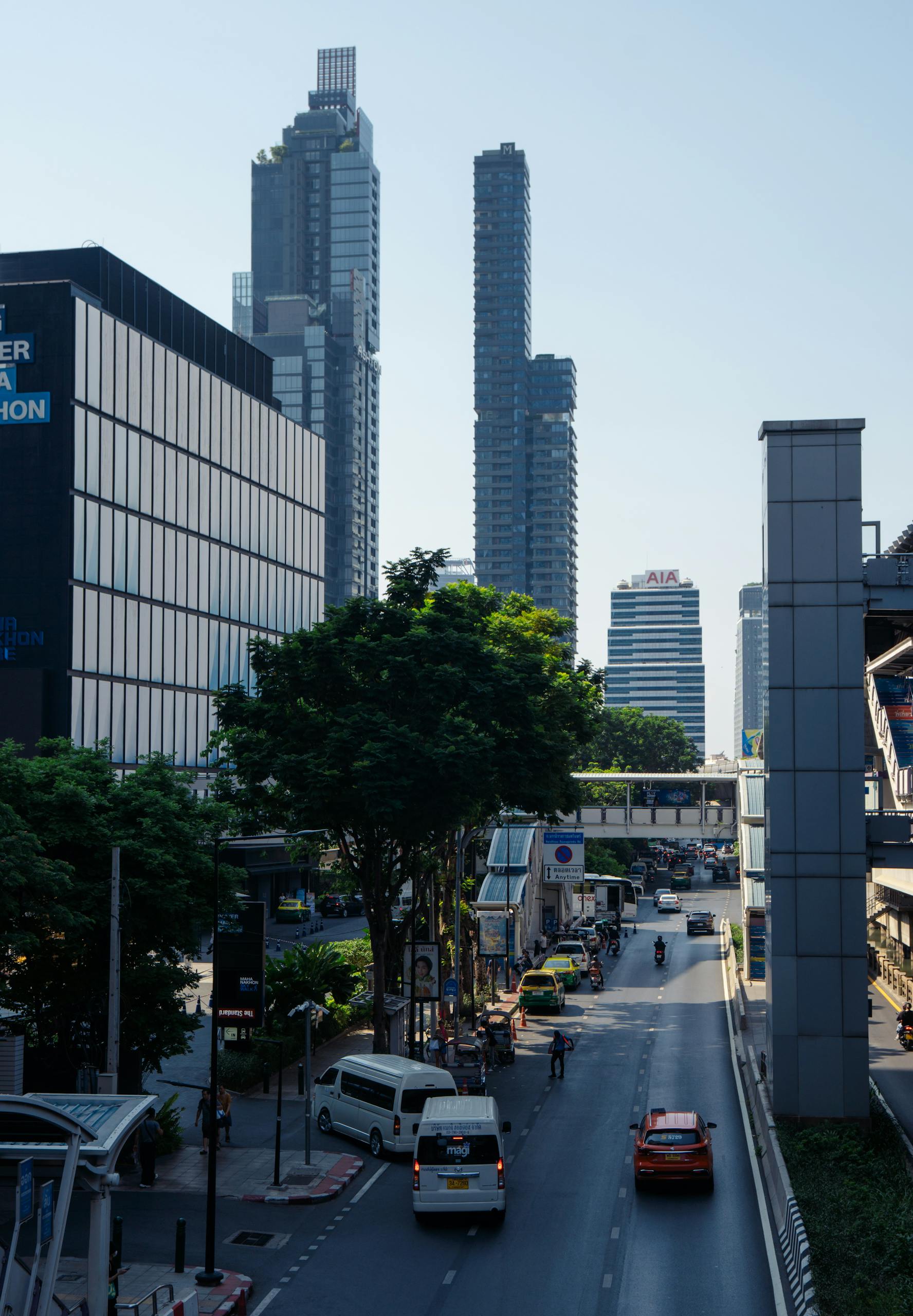View of Bangkok's urban skyline with modern skyscrapers and busy streets, capturing the city's vibrant atmosphere.